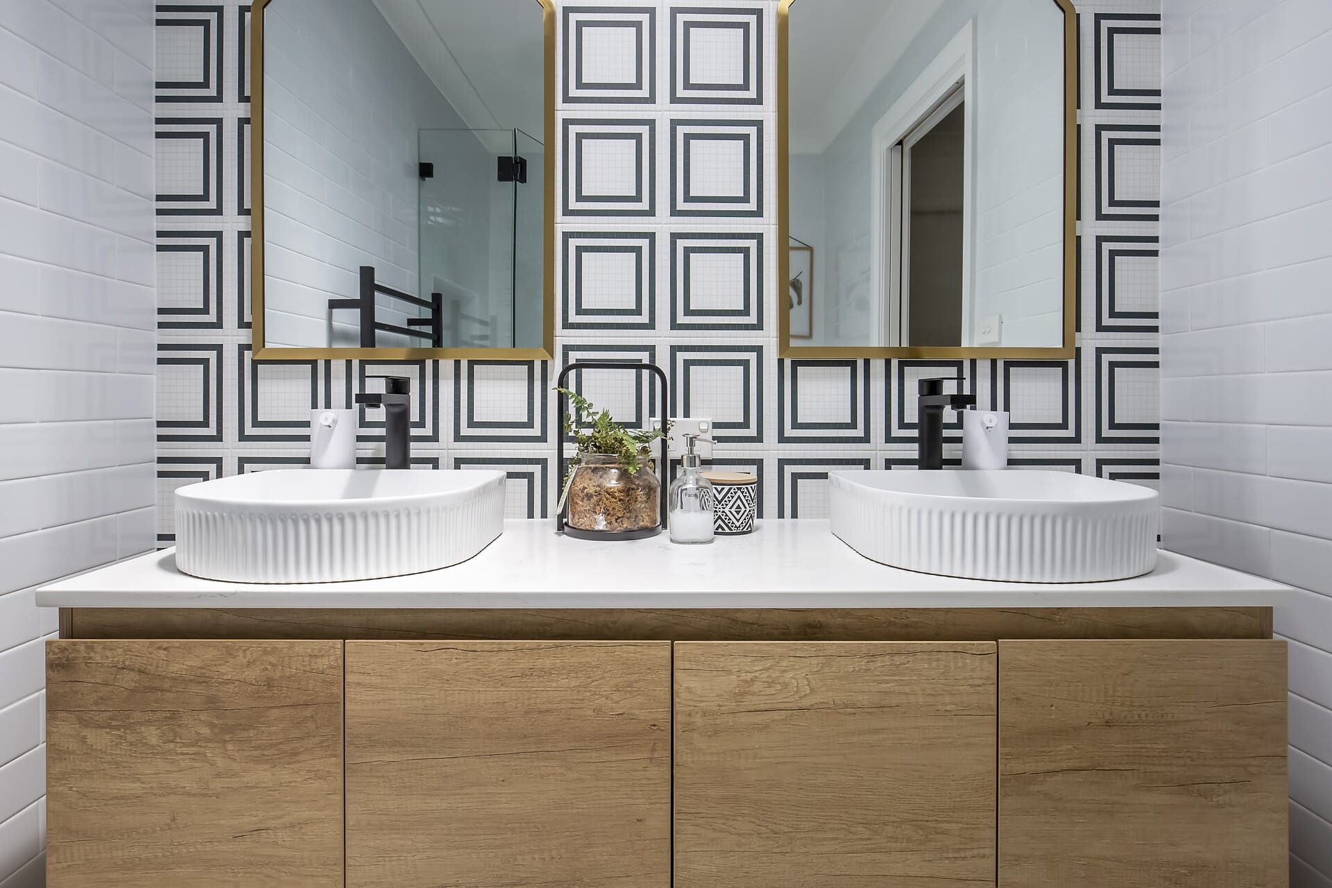 Stunning black and white tiles in renovted bathroom