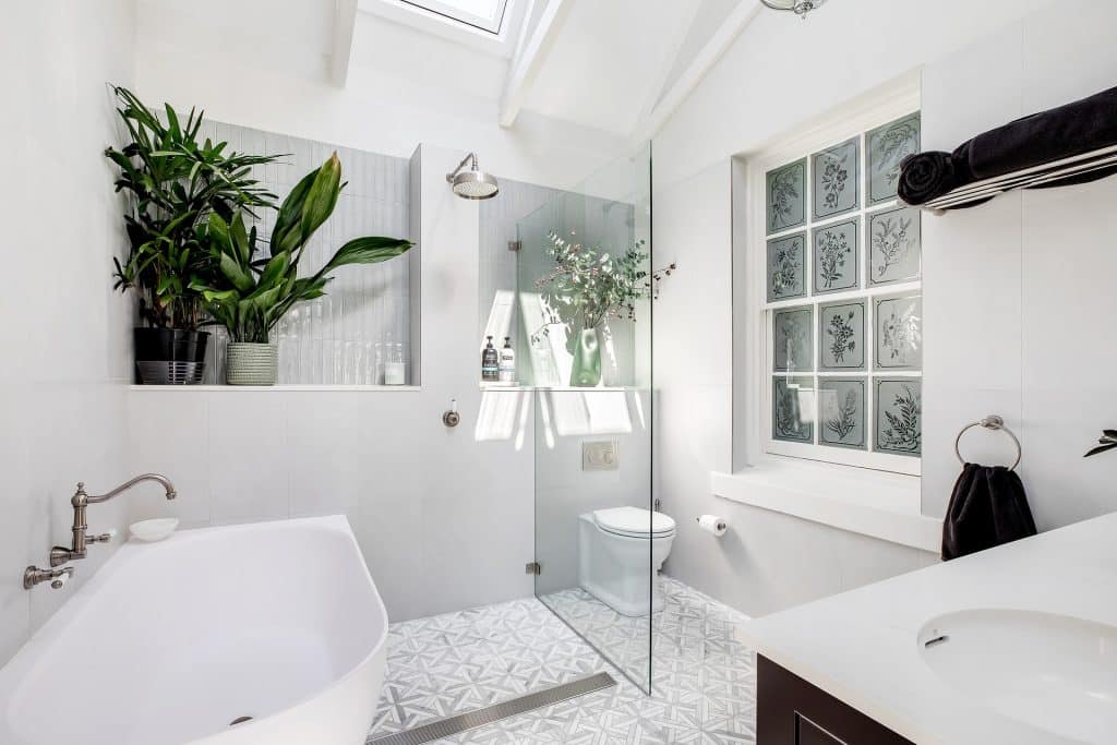 Gorgeous white bathroom renovation with correctly sealed wet areas.
