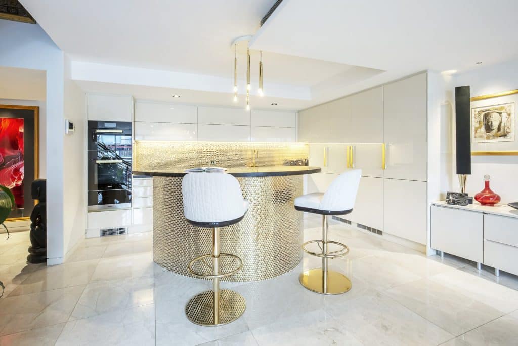 Bright kitchen renovation in gold and white