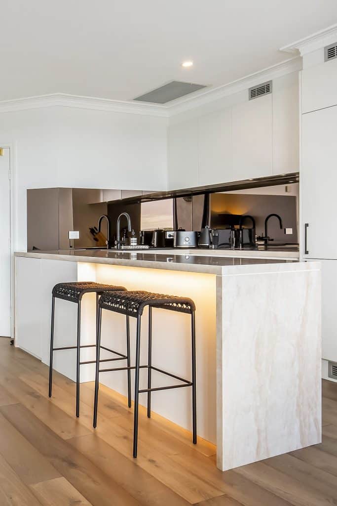 Sleek kitchen renovation with chic bar stools