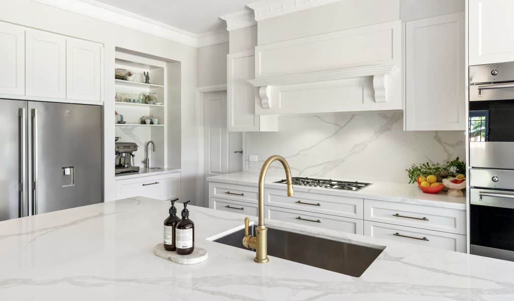 Great storage in a chic white kitchen renovation