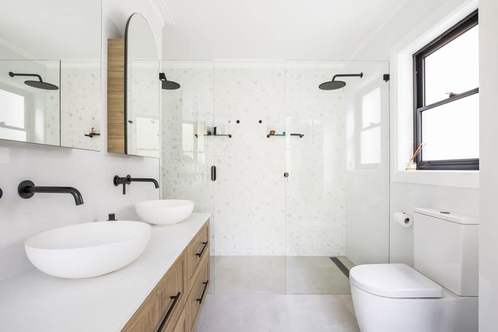 Gorgeous white bathroom renovation with contrasting tapware