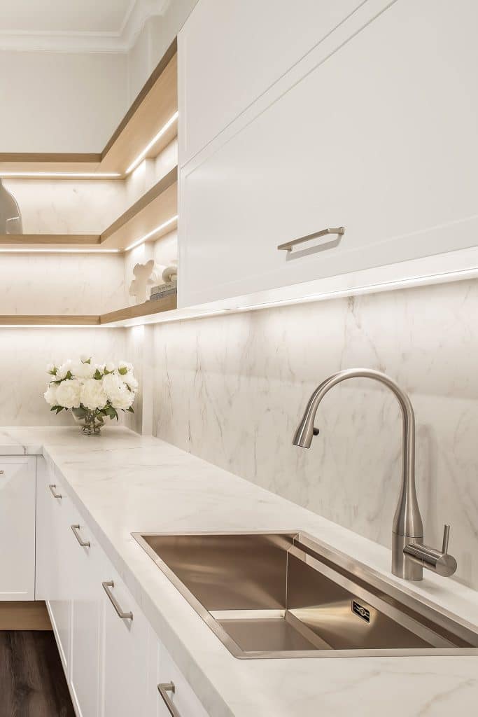 Sleek kitchen renovation in white