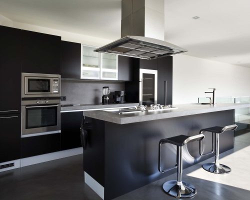 A modern kitchen in stunning black with white accents modern kitchen design images